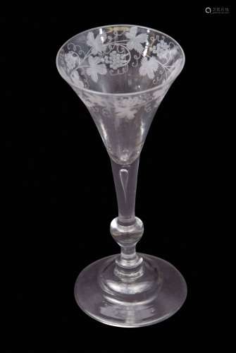 Mid-18th century light baluster wine glass with trumpet bowl engraved with fruiting vine above a