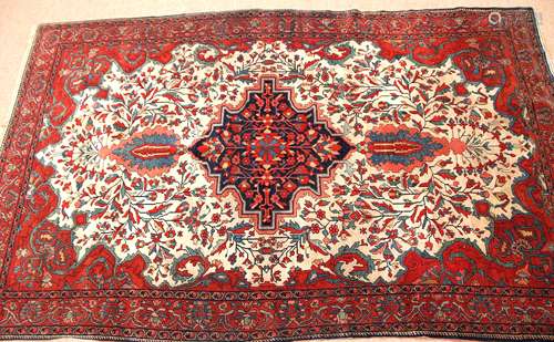 Early 20th century Oriental silk/wool carpet, triple gull border and central floral lozenge,