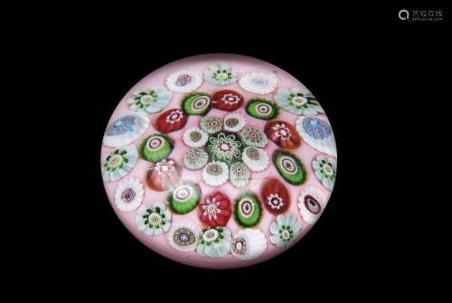 19th century Clichy paperweight, the salmon pink over white ground set with three rows of