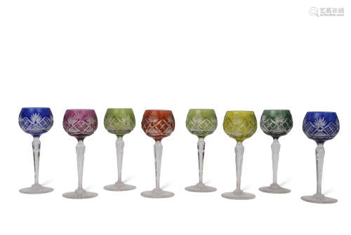 Group of eight English cut glass wine glasses or hock glasses, various colours, two blue stained,
