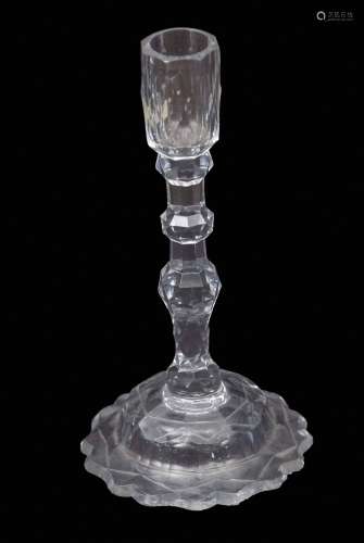 Late 18th century/19th century faceted glass candlestick with faceted sconce above a three knop