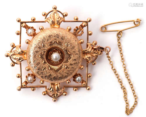 A mid-grade yellow meal and seed pearl brooch with engraved shield centre applied with a small