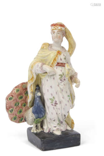 Early 19th century pearlware figure of Juno on square black base with a peacock by her side,