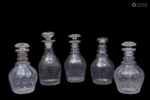 Group of four 19th century cut glass decanters with mushroom stoppers, together with a further