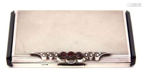 Early 20th century black composite mounted and white metal powder compact of rectangular form with