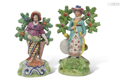 Two Walton type Staffordshire figures, circa 1840, standing against bocage, one of a fish seller,