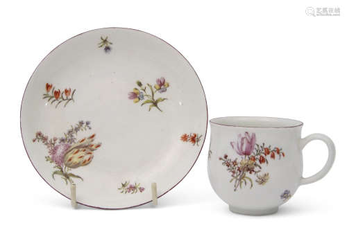 18th century Chelsea red anchor porcelain cup and saucer, the bell shaped cup with brown line rim