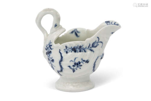 Worcester dolphin shape ewer of typical moulded design, painted in blue with trailing flowers