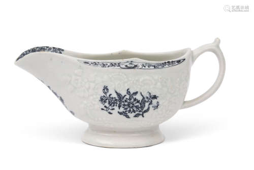 Large 18th century Lowestoft porcelain sauce boat, the body with a moulded design with flowers