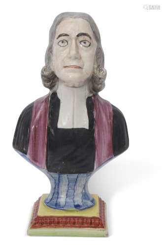 Wood type figure of John Wesley on a rectangular base decorated in polychrome, 25cm high