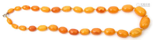 Vintage amber bead necklace, a single row of graduated oblong beads, 1-2cm of butterscotch and egg