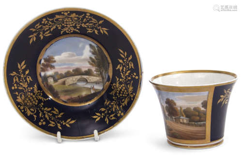 Chamberlain Worcester cabinet cup and saucer, the blue gilt ground with a painted view of Cranford