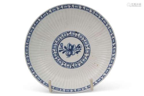 18th century Lowestoft porcelain saucer, the reeded body with a floral sprig to centre, bordered