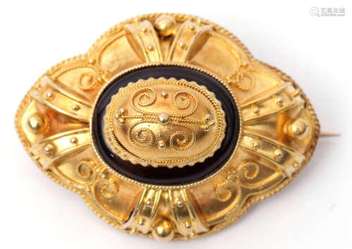Victorian yellow gold and onyx target brooch, circa 1880, centred with a filigree decorated dome and