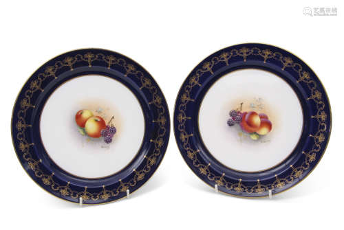 Pair of early 20th century Royal Worcester plates, the centres painted with fruit, by Townsend,