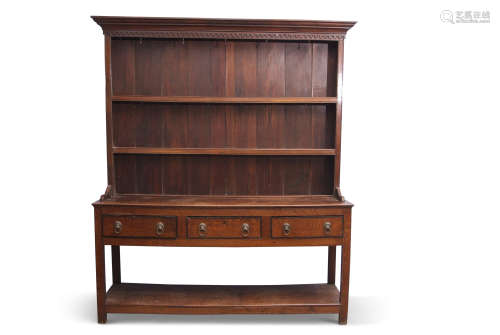 Late Georgian mahogany oak dresser having a two-shelf panelled back, the base section of three