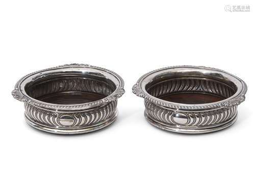 Pair of George III coasters of circular shape with applied shell and gadrooned rims, wrythen fluting