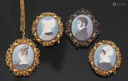 Cased Georgian school four hand painted family miniatures on ivory, two with buckle mounts, one