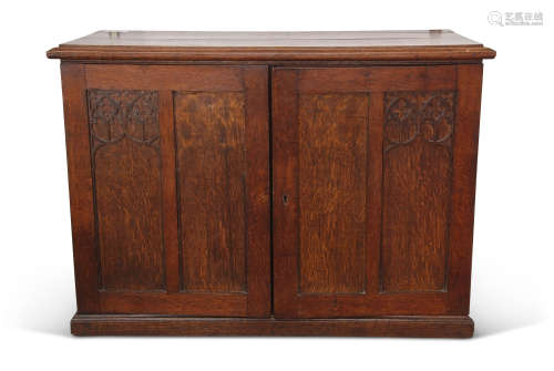 Wall fitting oak collector's cabinet having moulded edge top above two panelled doors with (partial)