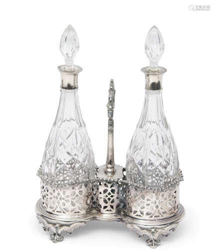 Victorian silver plated double bottle stand of waisted oval form, the raised holders pierced with