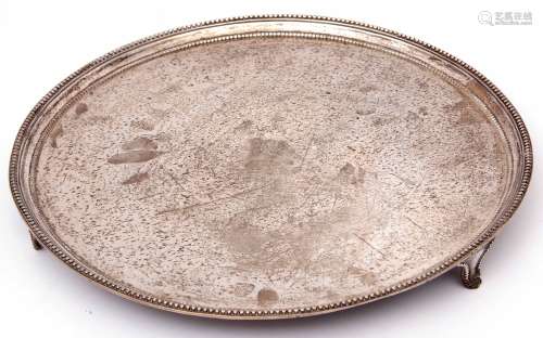 George III circular salver of plain design, beaded edge, pelican and crown armorial to centre,