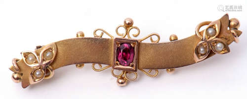 Victorian 9ct gold, ruby and seed pearl bar brooch, the centre oval faceted ruby framed on a