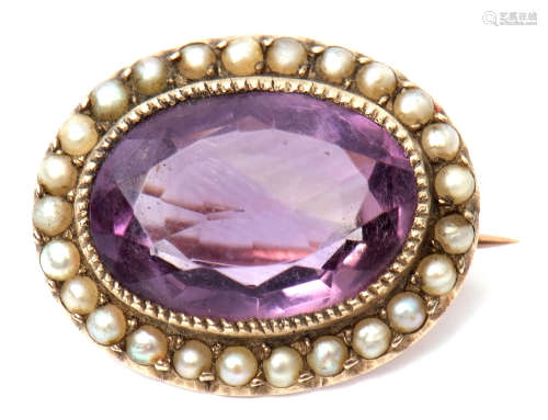 Early 19th century amethyst and seed pearl brooch, the oval faceted amethyst millegrain set within a