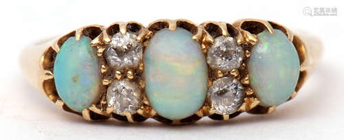 Late Victorian opal and diamond ring featuring three graduated oval cabochon opals highlighted