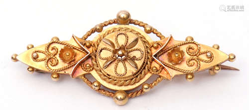 Early 20th century 15ct gold Etruscan brooch, typically decorated with scrolls, beads and rope twist