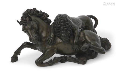 A patinated bronze group of a lion attacking a horse, 30cm wide x 18cm tall (max)