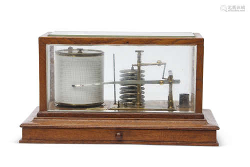 Early 20th century brass barograph with metal bellows housed in a glass panelled mahogany case