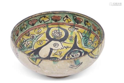 Nishapur pottery bowl, Persian, probably 9th/10th century, the bowl decorated in black, green and