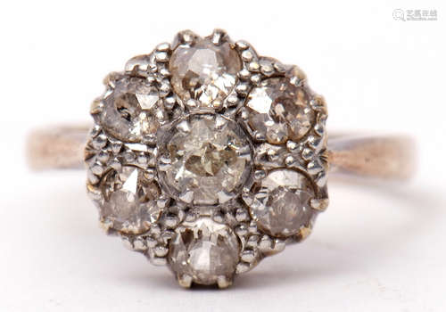 Diamond cluster ring featuring seven old cut diamonds, the principal diamond 0.15ct approx, in a