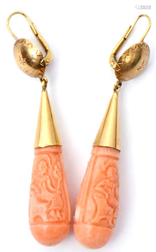 Pair of vintage carved coral torpedo drop earrings, each carved one side with a figure, the other