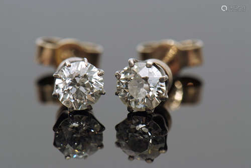 Pair of brilliant cut diamond stud earrings in coronet settings, total weight 0.50 approx