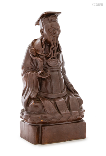 A Chinese Brown Glazed Porcelain Figure of an Immortal