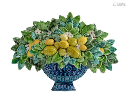 A Glazed Ceramic Wall Plaque of a Basket of Fruit and