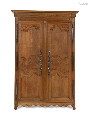 A French Provincial Carved Oak Armoire