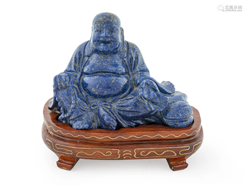 A Chinese Carved Lapis Figure of a Laughing Buddha