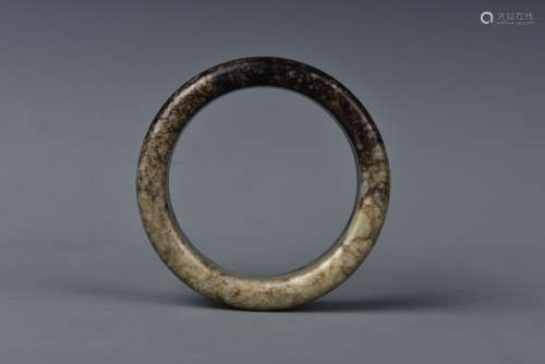 A CREAMY WHITE AND RUSSET JADE BANGLE MING DYNASTY