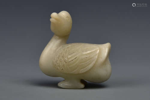 A CARVED WHITE JADE GOOSE