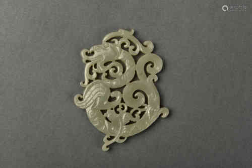 A RETICULATED CELADON JADE DRAGON AMULET QING DYNASTY
