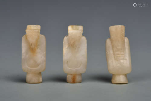 A GROUP WHITE JADE STANDING FIGURES HAN DYNASTY