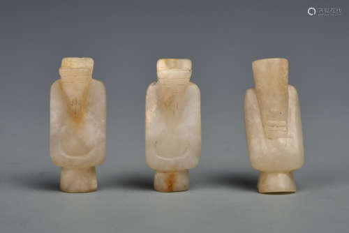 A GROUP WHITE JADE STANDING FIGURES HAN DYNASTY