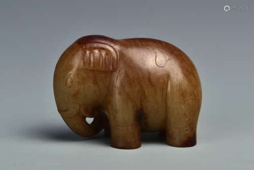 A CREAMY WHITE AND RUSSET JADE ELEPHANT QING DYANSTY