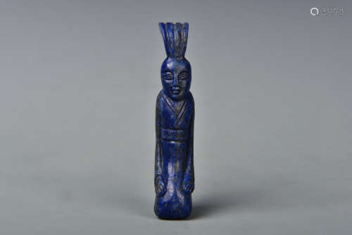 A CARVED LAPIS FIGURE