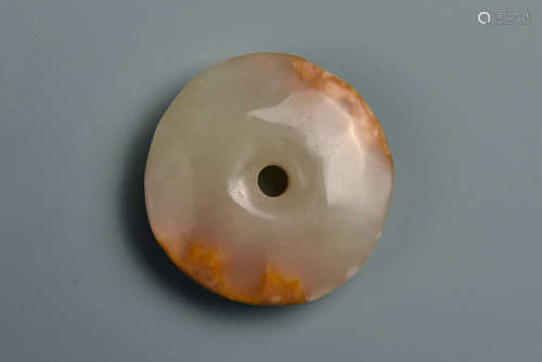 A PALE WHITE AND RUSSET JADE BI