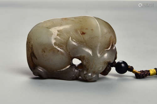 A CREAMY WHITE AND RUSSET JADE BUFFALO QING DYNASTY