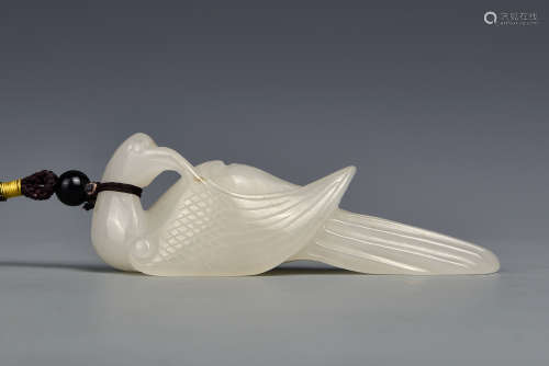 A CARVED WHITE JADE PHOENIX