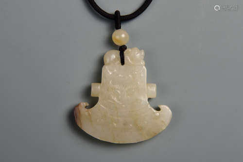 A WHITE AND RUSSET JADE AXE 13TH CENTURY